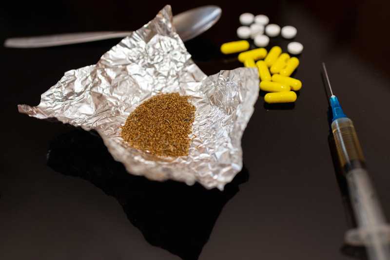 drugs and syringe image representing drug trafficking